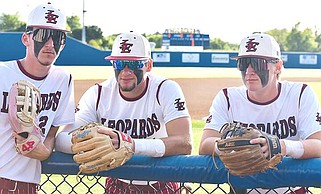 A trio of Liberty-Eylau players take a quick break between innings of a recent baseball games. Pictured are, left to right, Hagen Power, W.T. Jones and Britain Pipes. The Leopards will battle Tyler Chapel Hill in bi-district. (Photo by Timothy Brown, courtesy L-E athletics)
